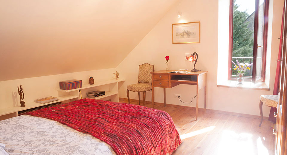 An additional double bed bedroom in the main house, for the "True French Experience" offering